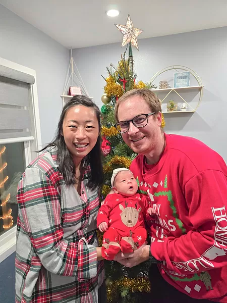 Photo of Michael McNab, his wife, and their beautiful baby girl, named Bethany